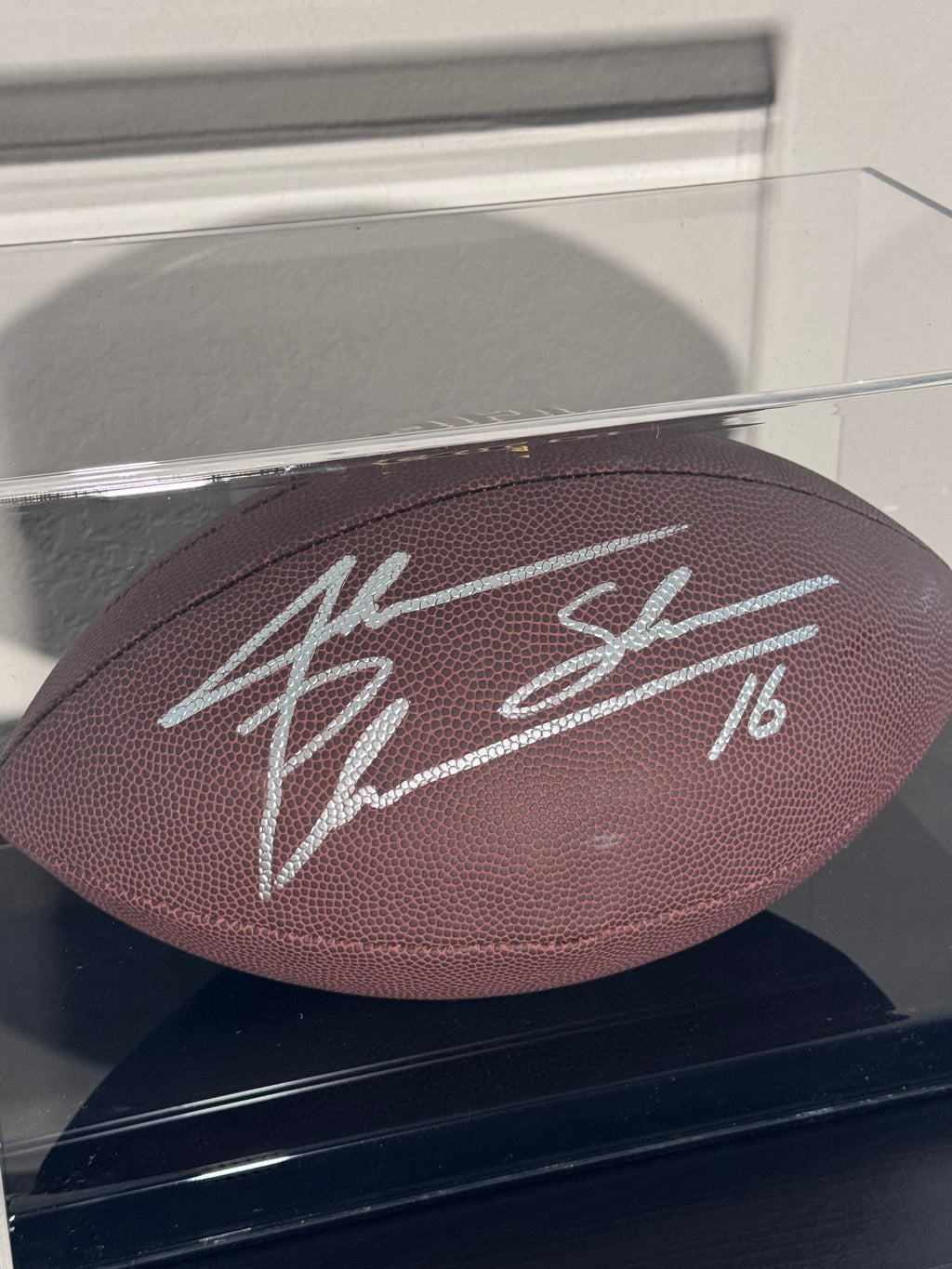 Jake Plumber Autographed Football (Schwartz) With Case.